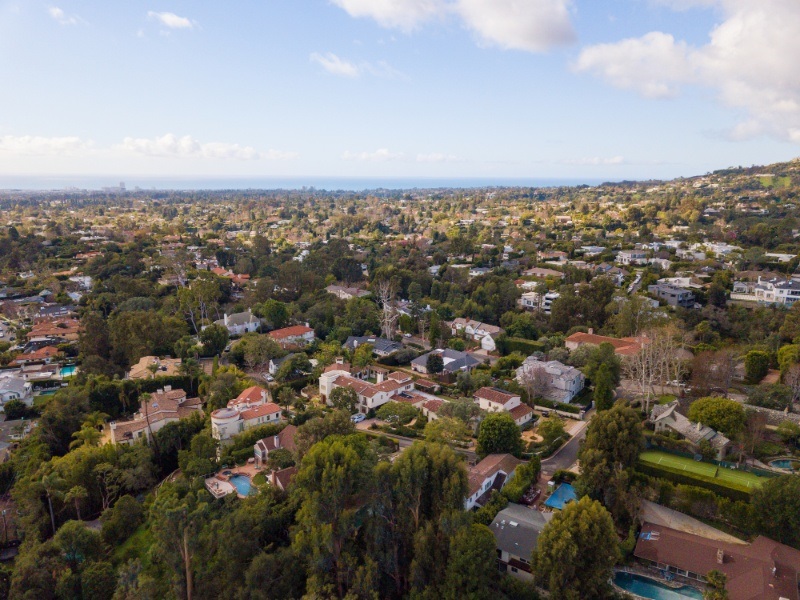 Brentwood tree-lined street with luxury homes