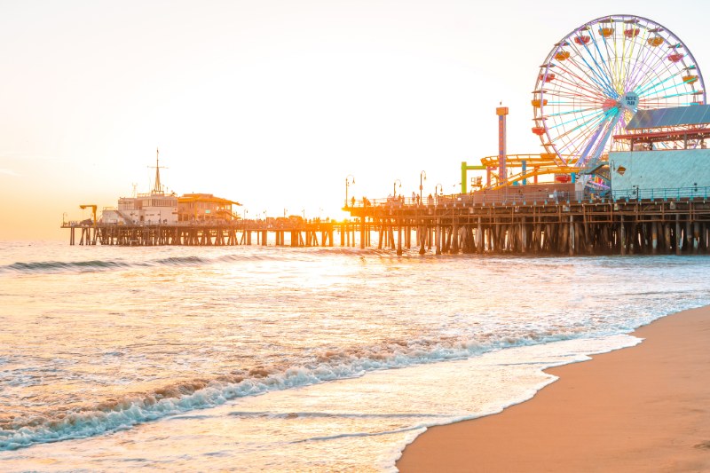 Santa Monica Pier stretching into the Pacific Ocean at golden hour