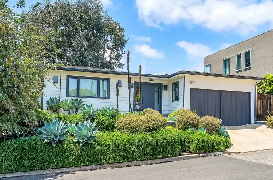 Single story Westside home with a landscaped front garden seen from the street